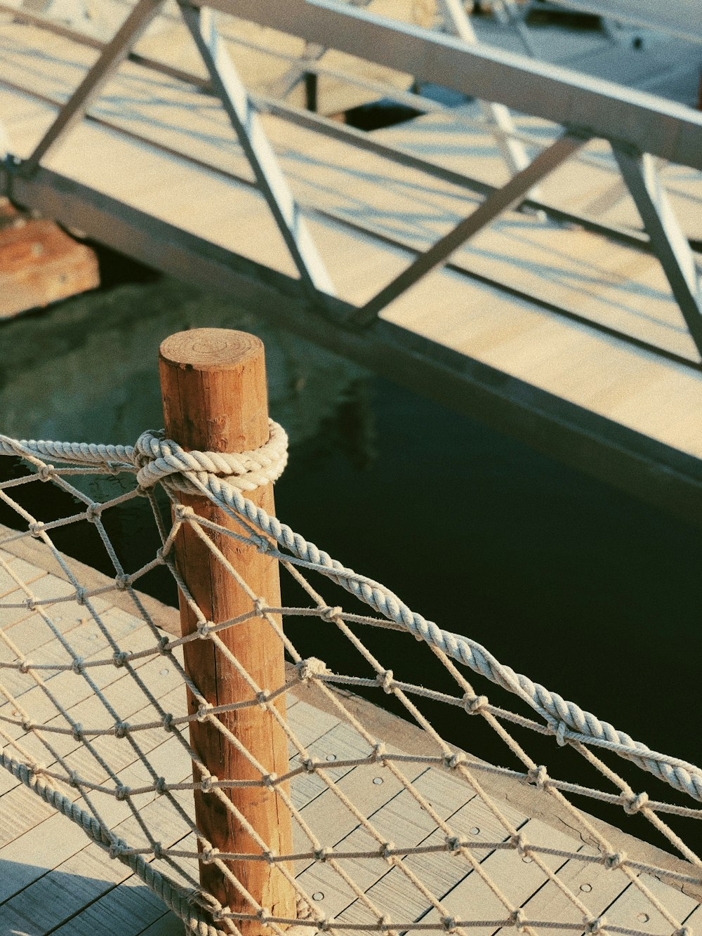 close-up photo of gray rope fence