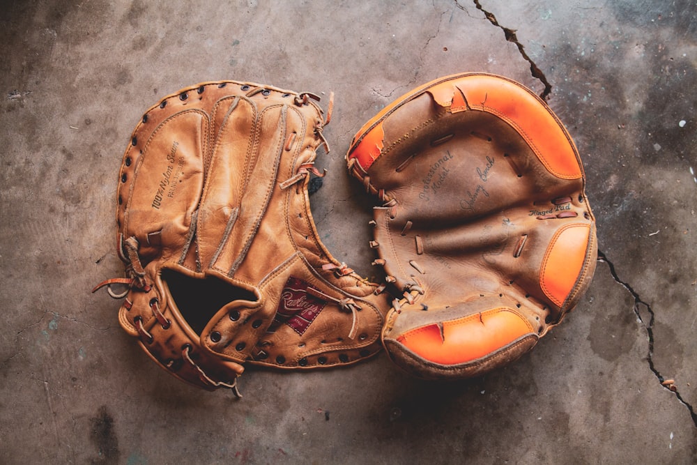 a baseball glove laying on the ground