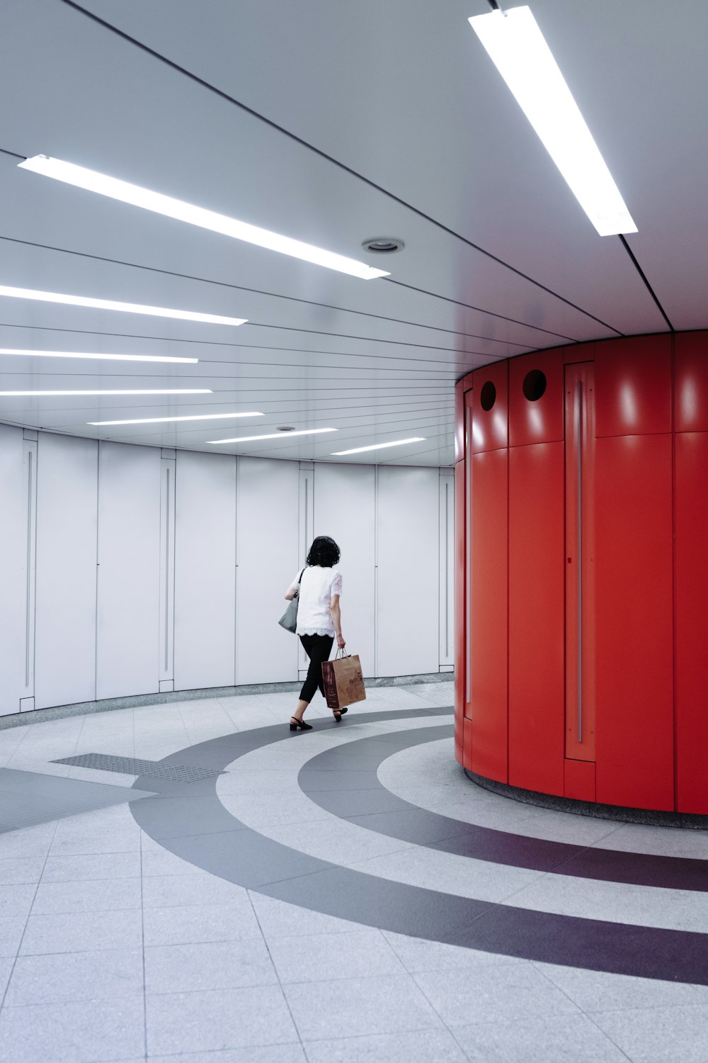 woman walking in hallway