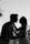 silhouette grayscale photo of man and woman attempting to kiss