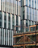 Contemporary building facade featuring vertical gardens and natural wood elements.