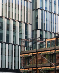 Modern building facade combining metal and wood elements harmoniously.