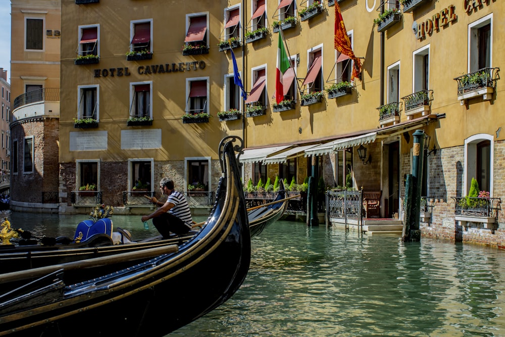 two sailboat beside buildings