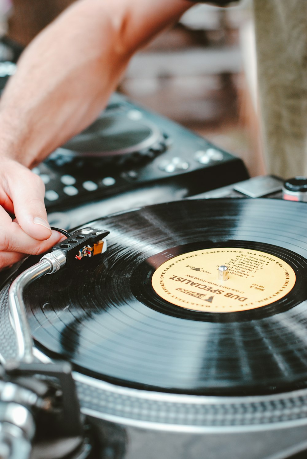 person playing turntable