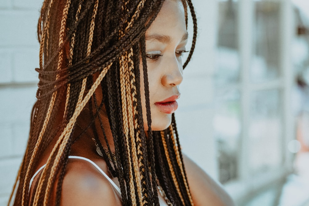 selective focus photography of woman with braided hair