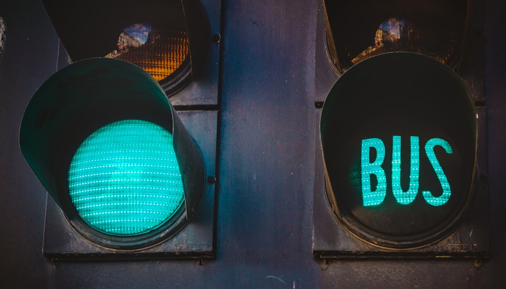 close-up photo of black metal street light at green light