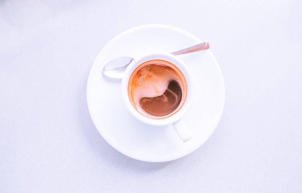 white ceramic mug with coffee