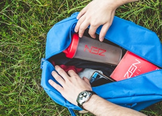 clear plastic tumbler inside blue bag