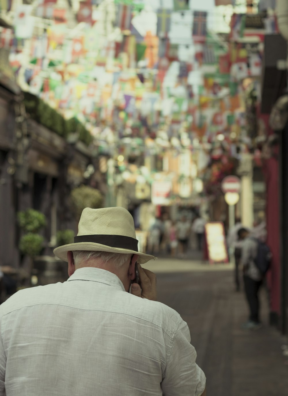 shallow focus photo of man using mobile phone