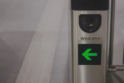 Security turnstile with antenna tags controlling access in a condominium lobby.
