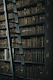 library shelf near black wooden ladder