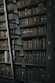 library shelf near black wooden ladder