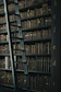 library shelf near black wooden ladder