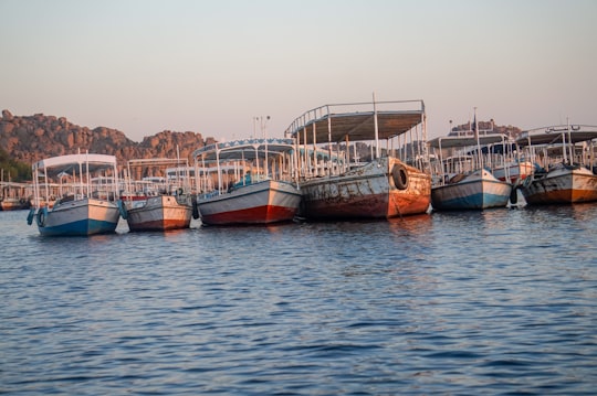 boats on body of water at daytime in Aswan Dam Egypt