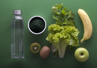 assorted fruits and vegetables on green surface