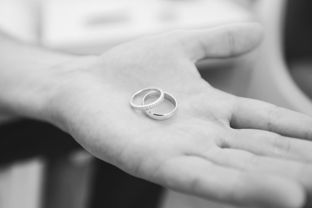 wedding bands grayscale photo