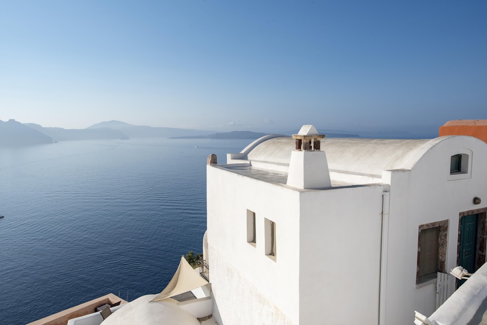 white painted building near sea