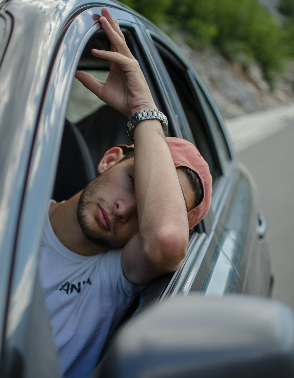 man sitting inside car