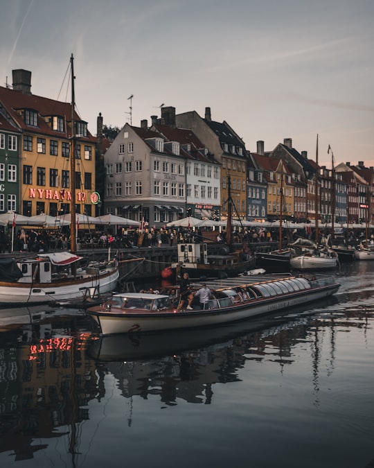 white boat on body of water in Nyhavn Denmark