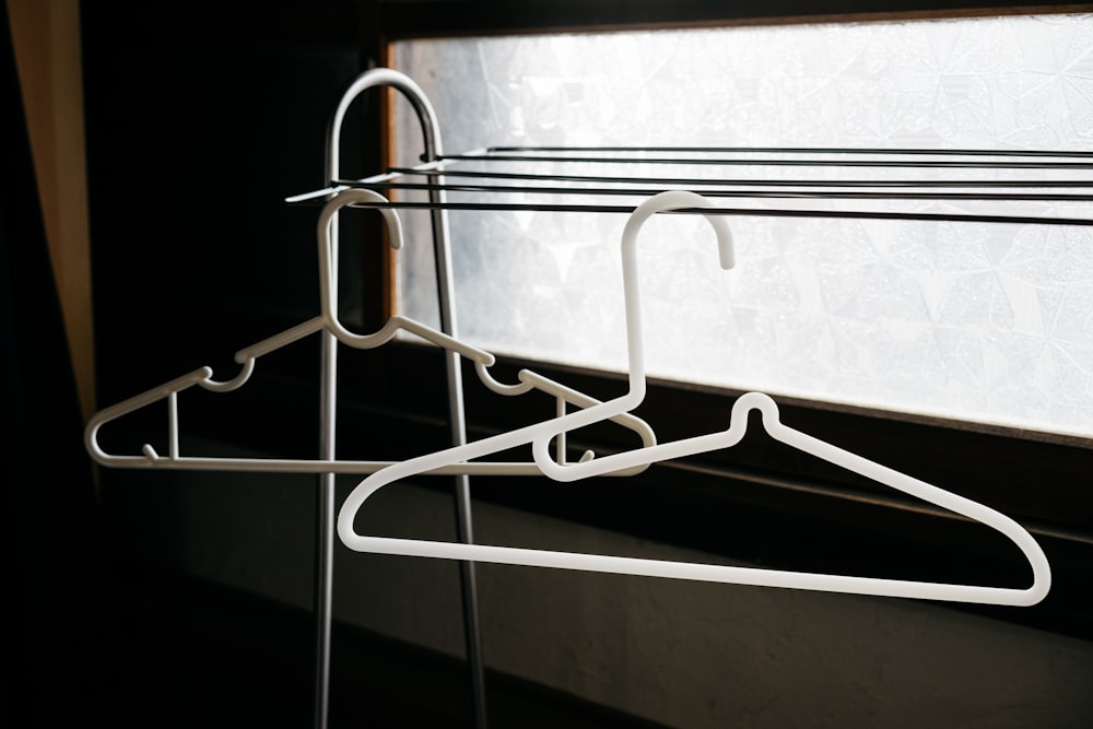 two white clothes hangers