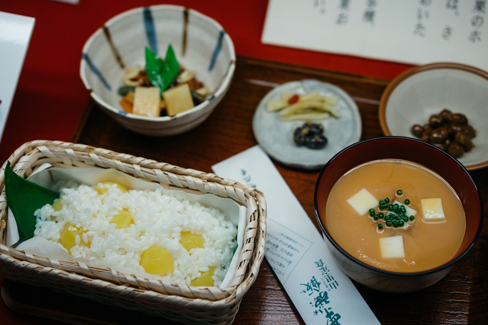 cooked foods in bowls and plates