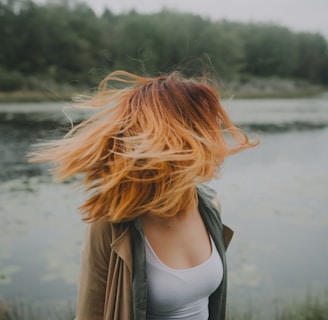 woman looking back near river