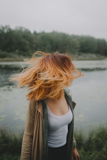 woman looking back near river