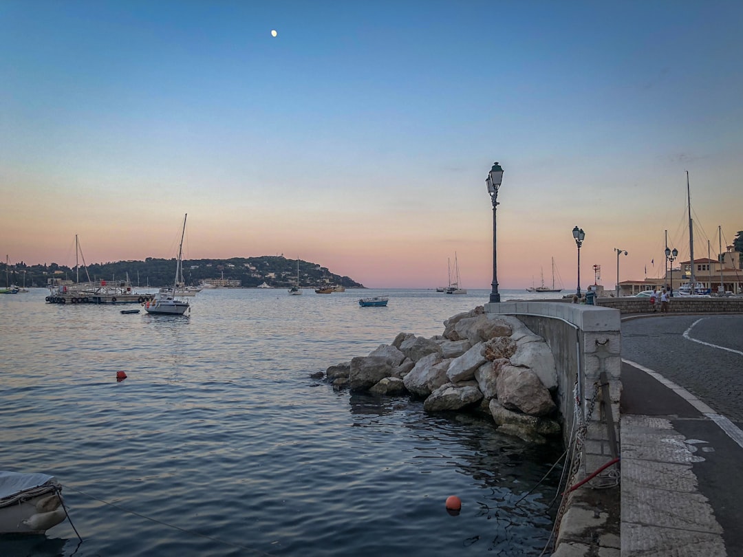 boat on body of water near the city, Sunset on the Mediterranean