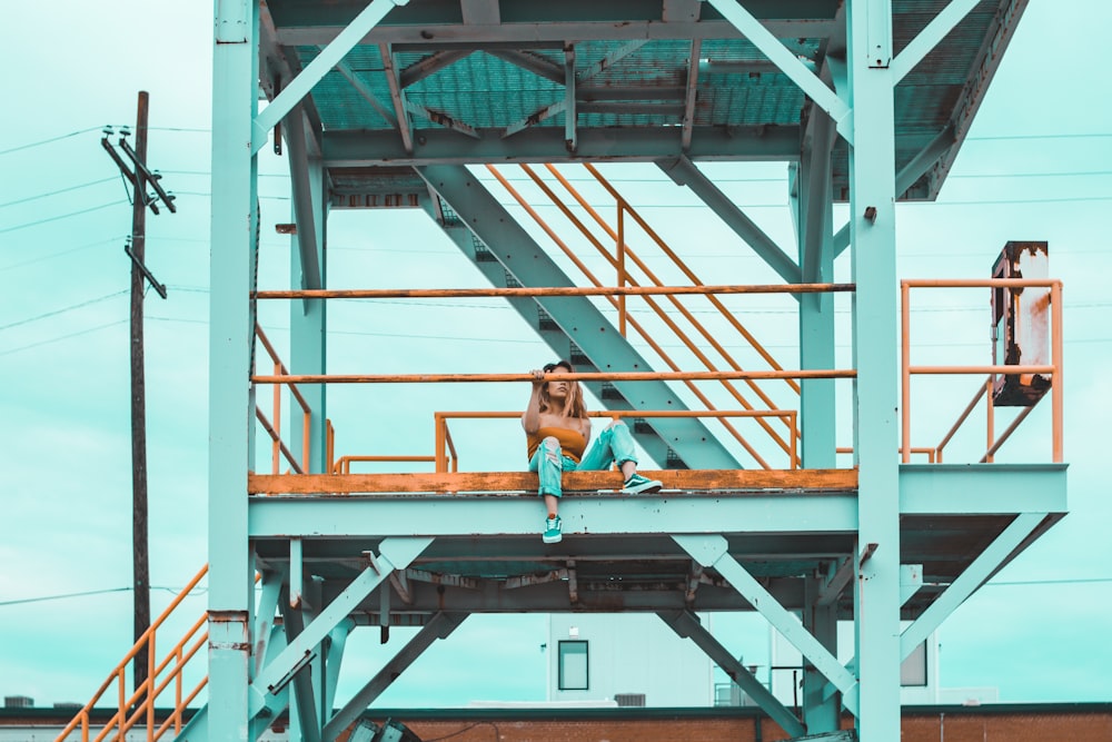 woman sitting on balcony