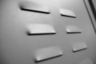 Colorful selection of air vents displayed on a wooden surface, highlighting variety of finishes.