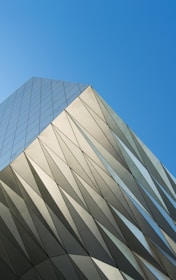 Modern building facade featuring clean lines and fresh paint under bright sunlight.
