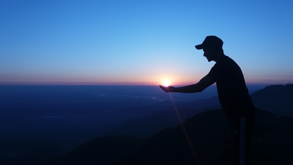 silhouette man during golden hour