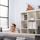 Smiling recruiter discussing job opportunities with a candidate in an office setting.