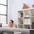 A smiling customer sharing their positive experience in a cozy office setting.