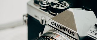 closeup photography of black and gray Olympus camera