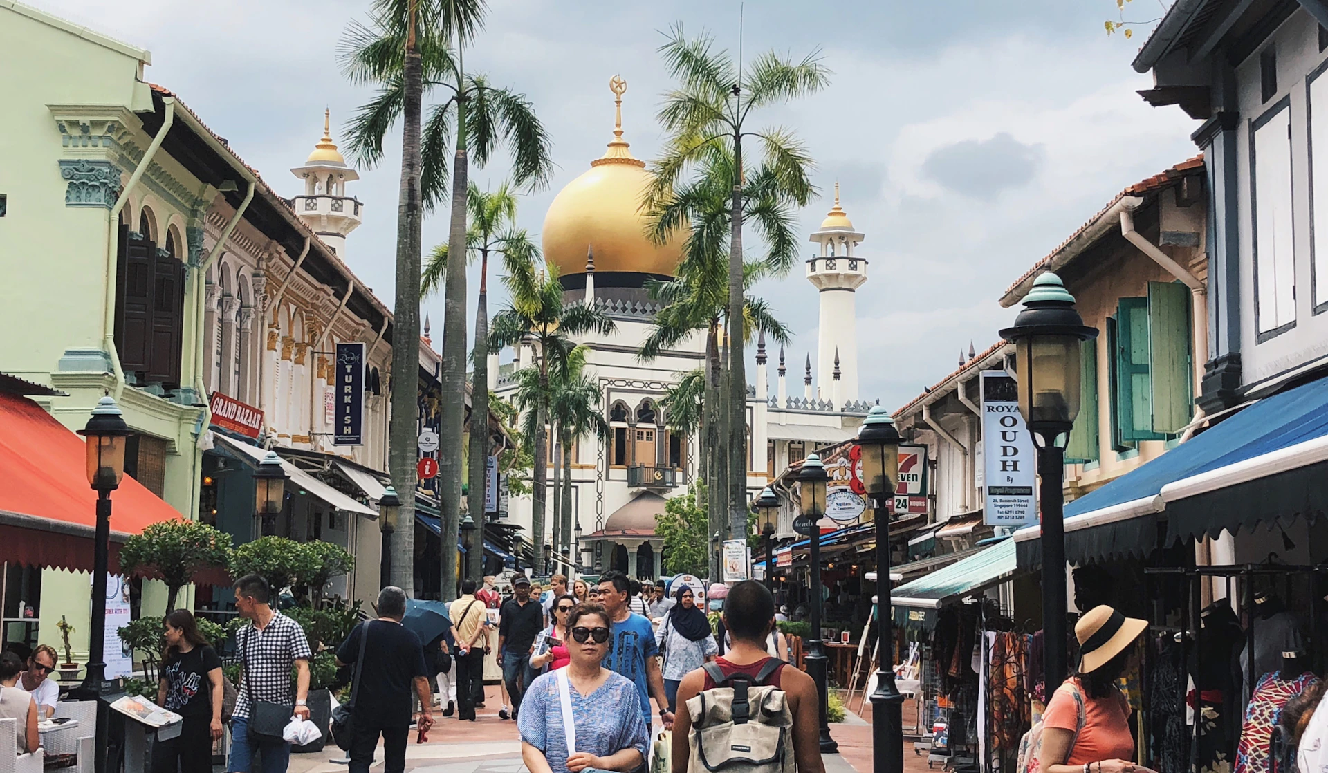 woman wearing yellow long-sleeved dress under white clouds and blue sky during daytime