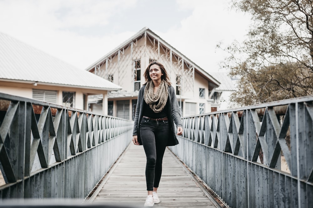 woman walking on bridge