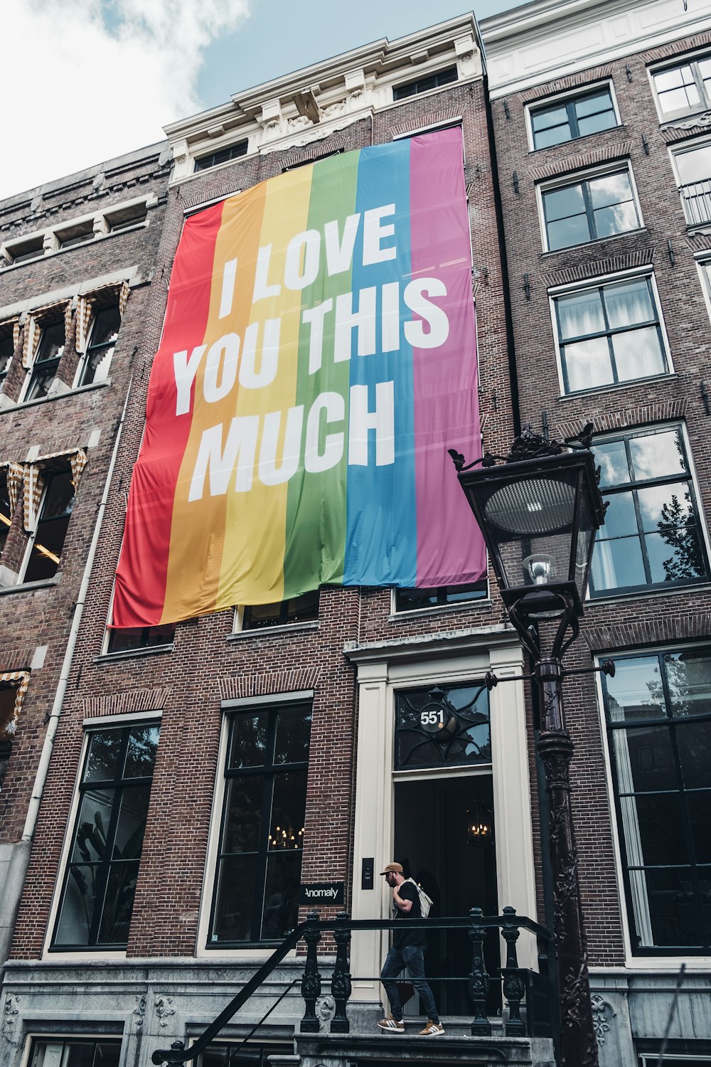 I love you this mush poster hanged on brown painted building