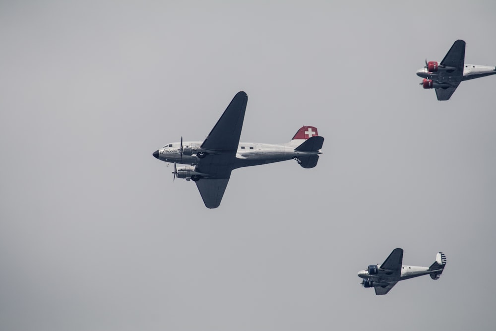 three gray fighter planes on air