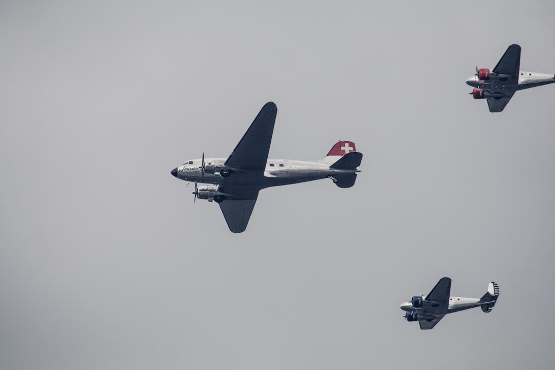three gray fighter planes on air,