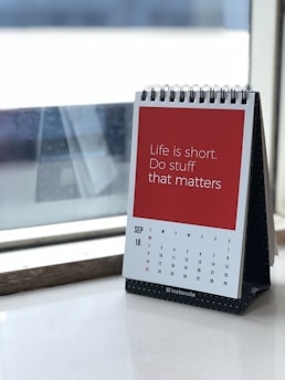 spiral freestanding calendar on white surface
