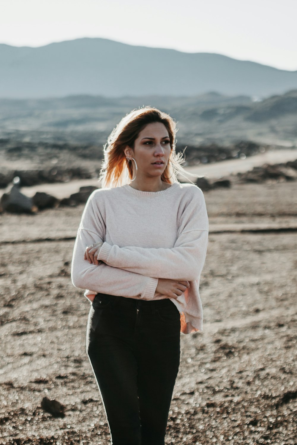 woman in beige top and black tops on brown soil during daytime