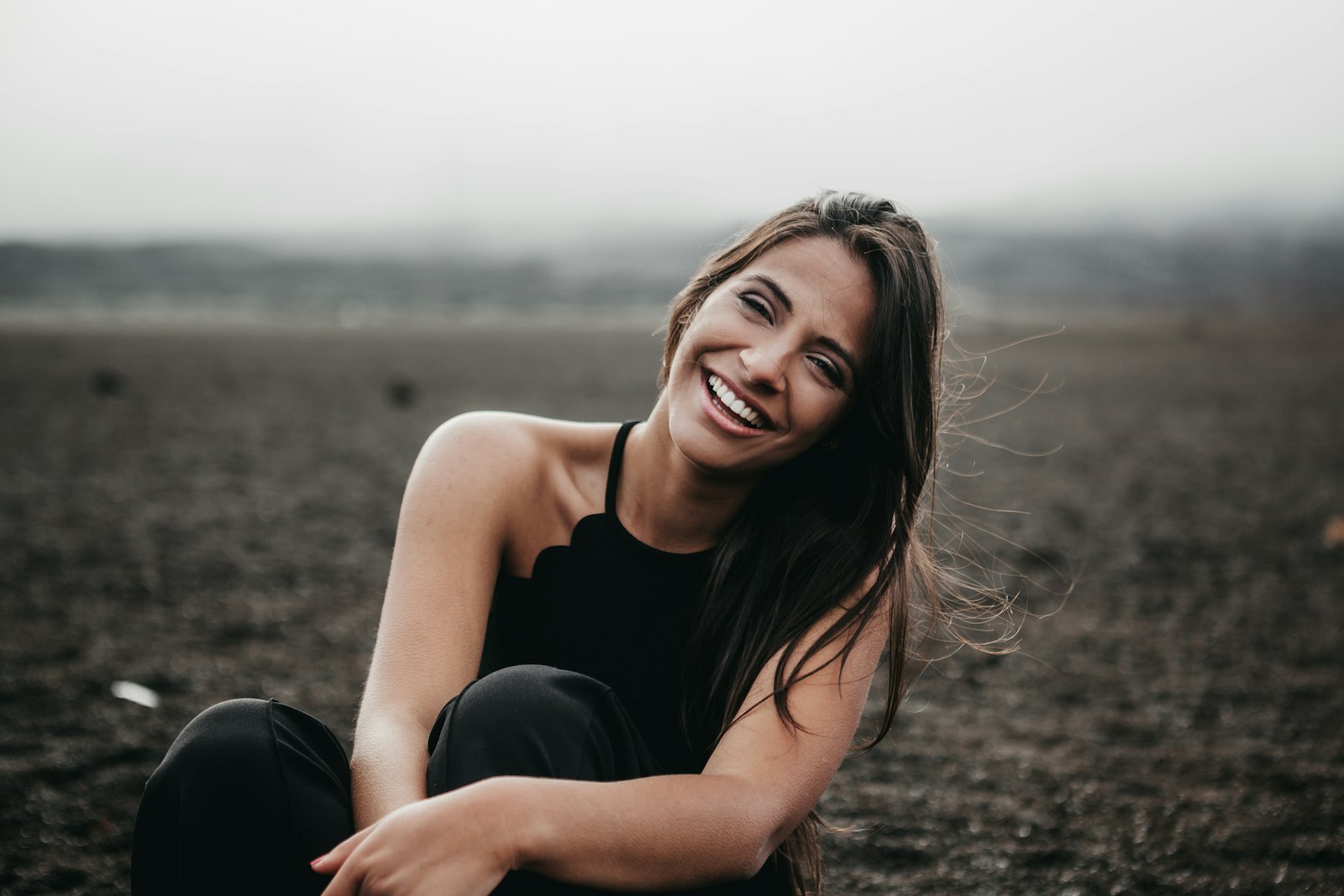 Canon EF 24-70mm F2.8L USM sample photo. Woman laughing while sitting photography