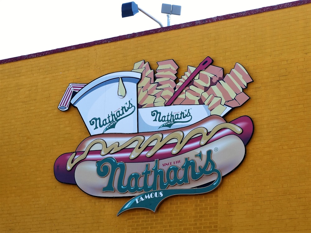 Nathan's food signage on yellow wall