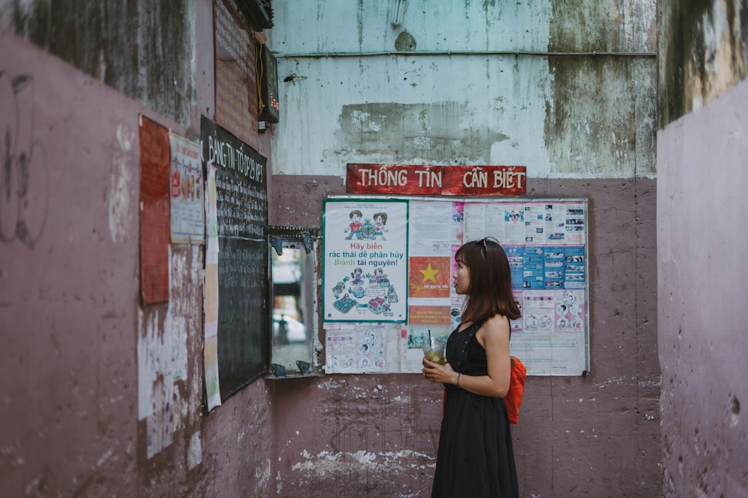 woman standing in front of dry erase board