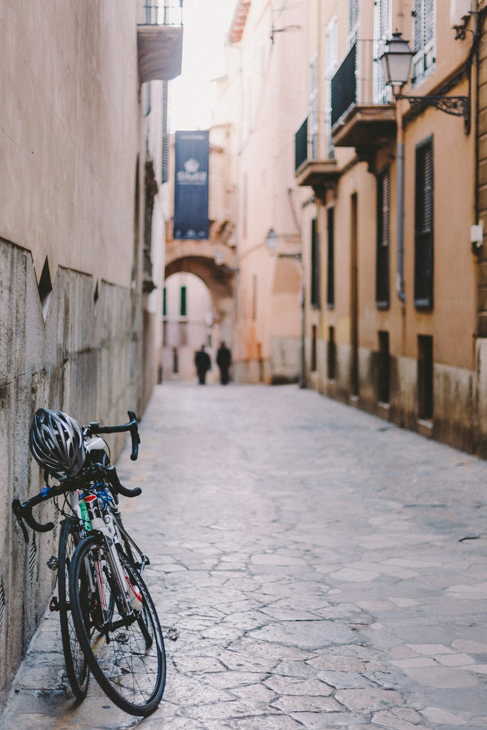 two bicycle parked on wall