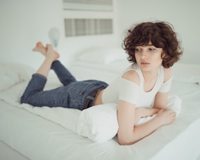 woman lying on bed
