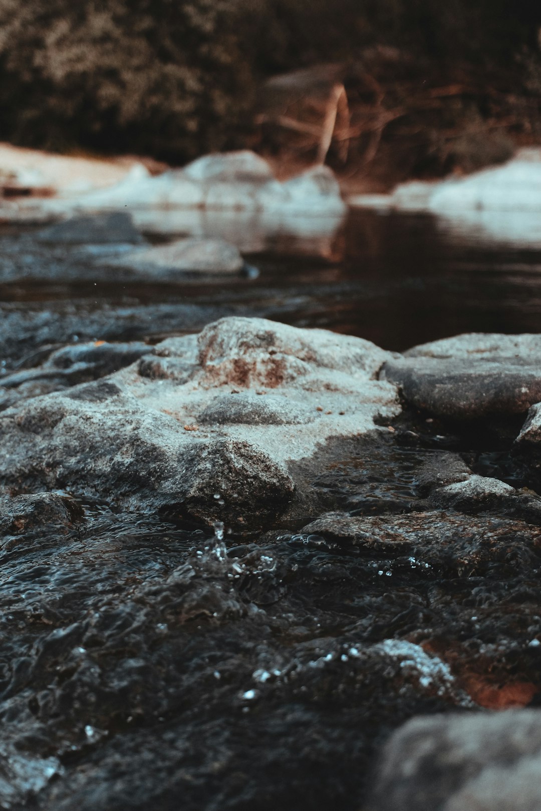 stone and body of water