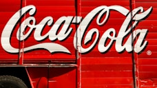 close-up photography of red and white Coca-Cola trailer