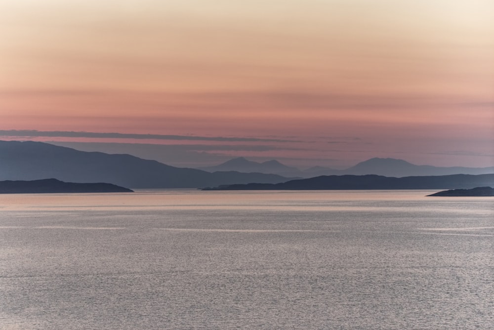 landscape photography of ocean and mountains